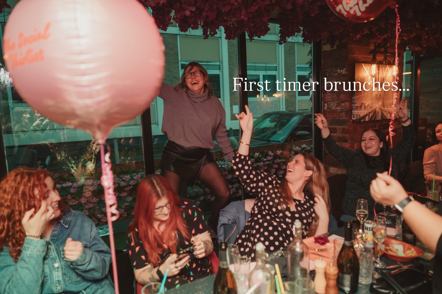 First-timer brunch with members laughing around a table