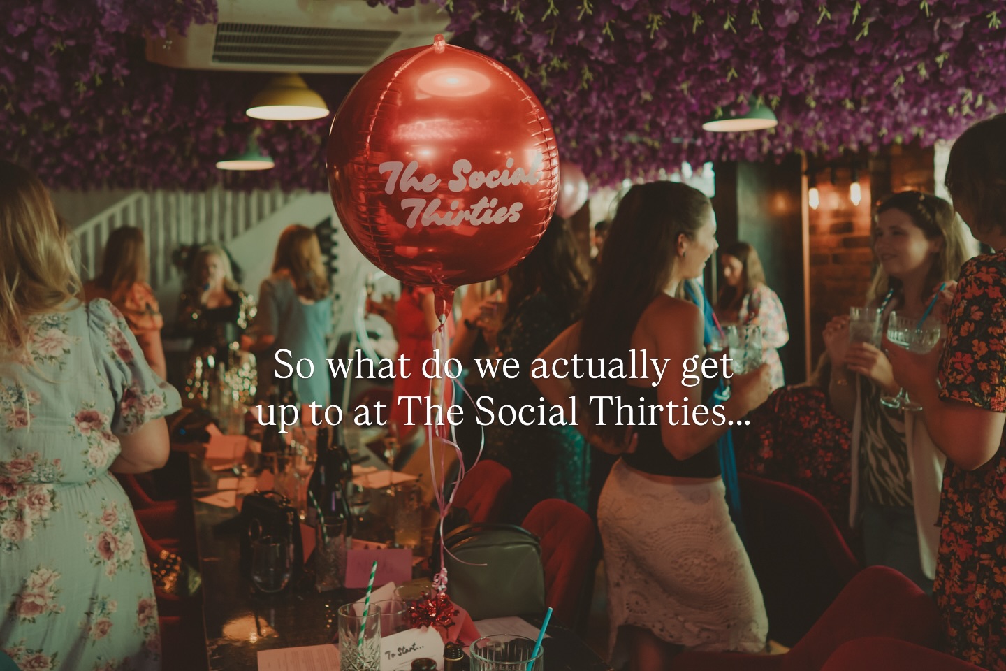 A Social Thirties event with members and the signature pink balloon