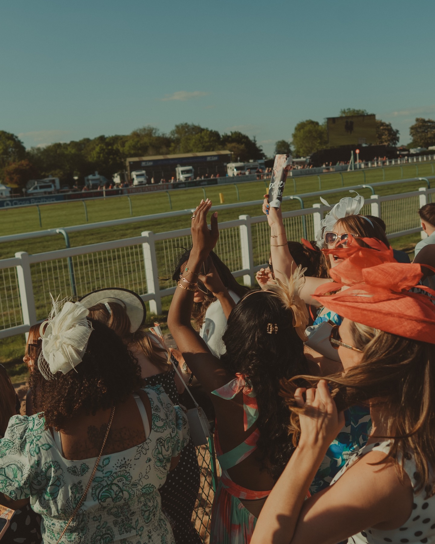 Members cheering at the races together